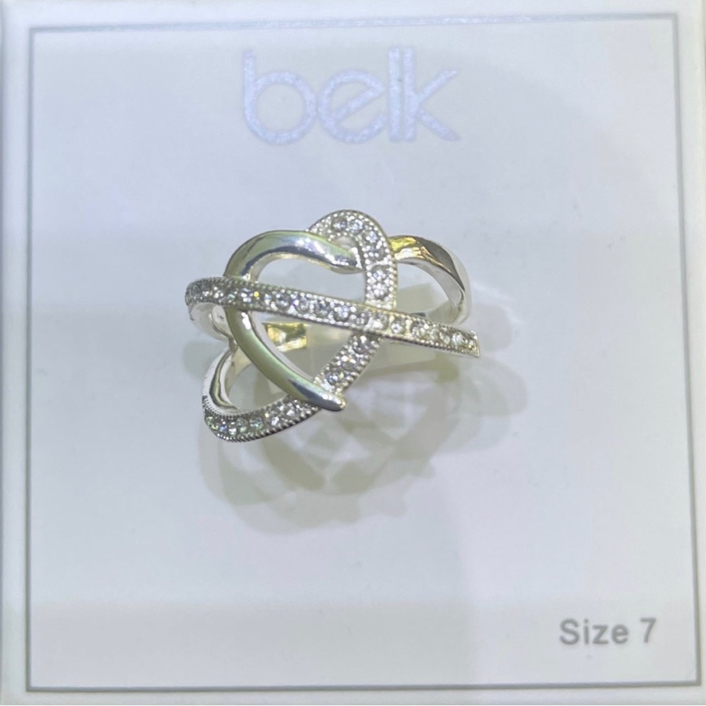 Silver tone heart ring with dazzling crystals from Belk size 7. New in box.